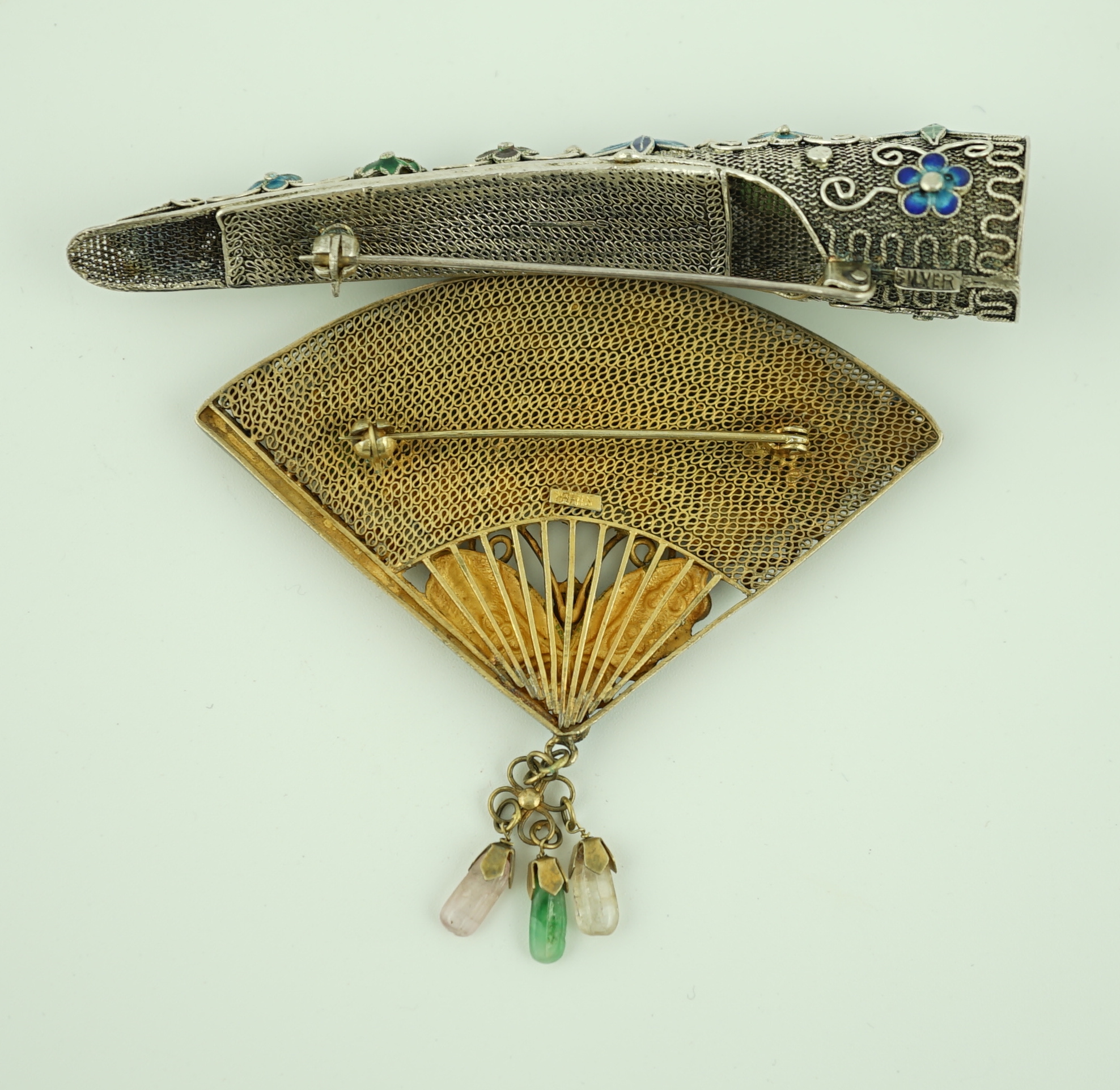 A Chinese silver, enamel and jadeite 'fan' brooch, width 69mm and a similar nail guard brooch, 87mm